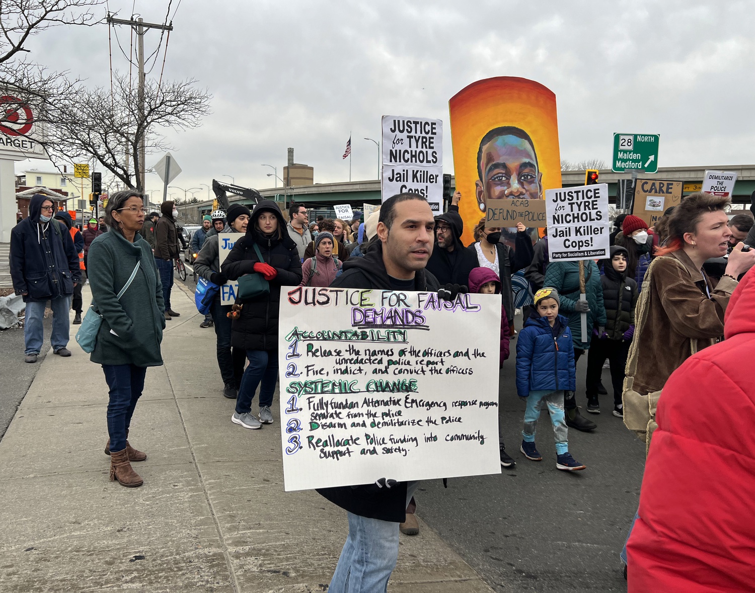 Protesters march on Cambridge Police headquarters in January following the police killing of Sayed Faisal. The department has come under intense scrutiny in the year since the fatal shooting.